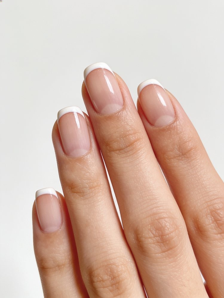 Short squoval nails with a very soft thin French tip