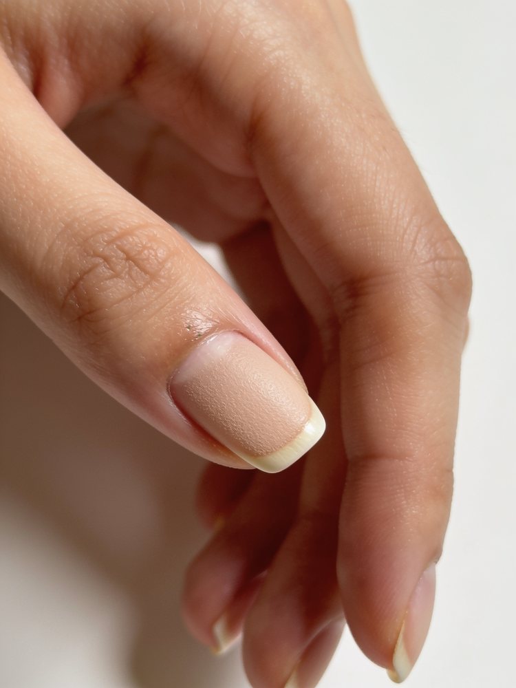 Very short bare buffed natural nails with immaculate cuticles