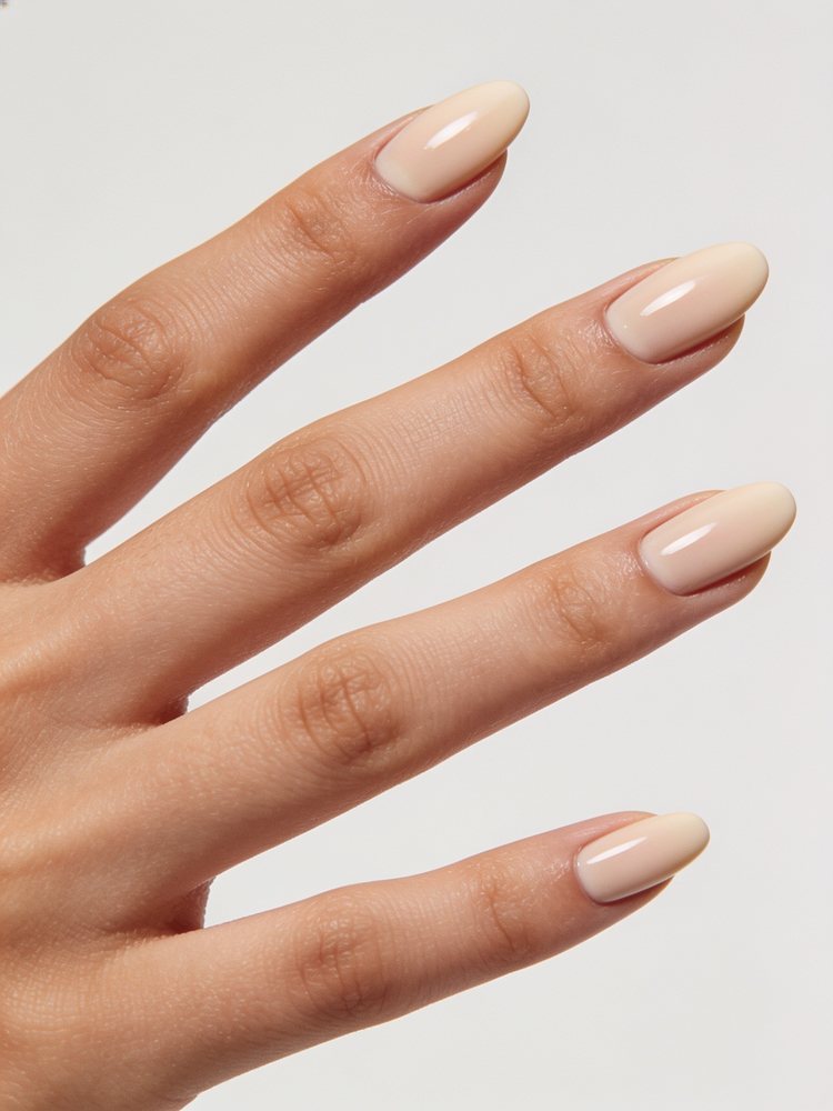 Medium oval nails in a creamy skin matched nude