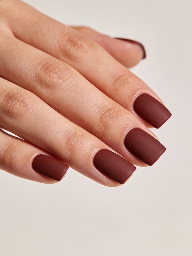 Short square nails in deep opaque oxblood red