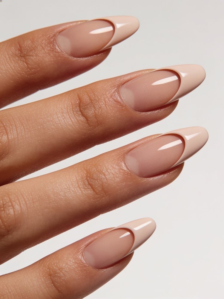 Short squoval nails with a deep curved arch across the nail in burgundy